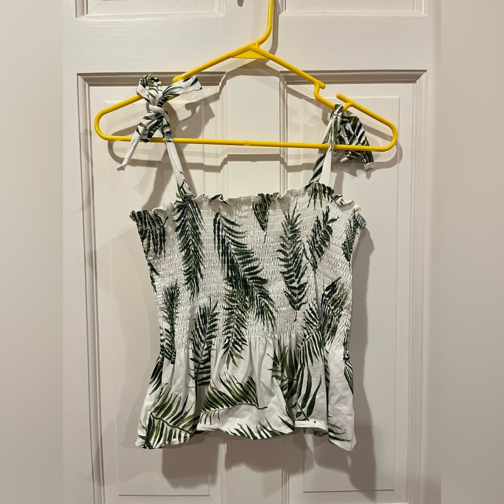 H & M Women’s Small peplum top with leaf print.